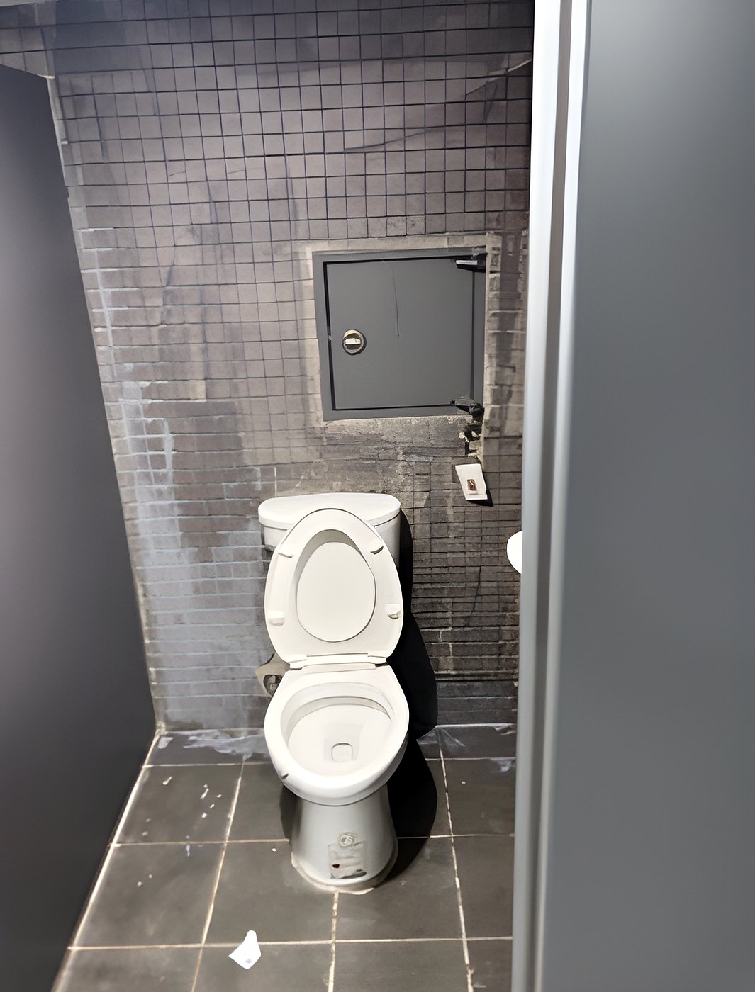 Nianqing Youwei Masonry | Restroom stall tiling in progress